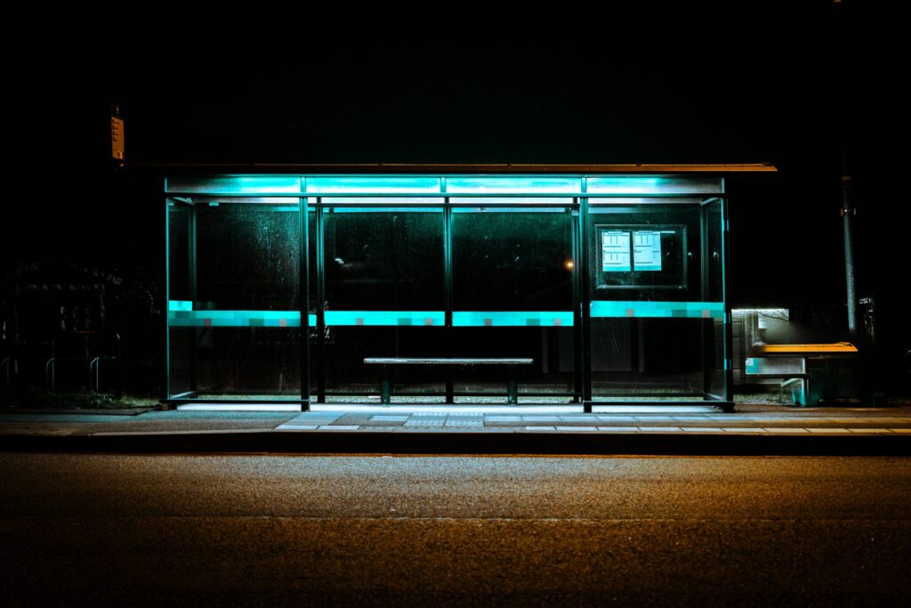 dimly lit bus stop at night